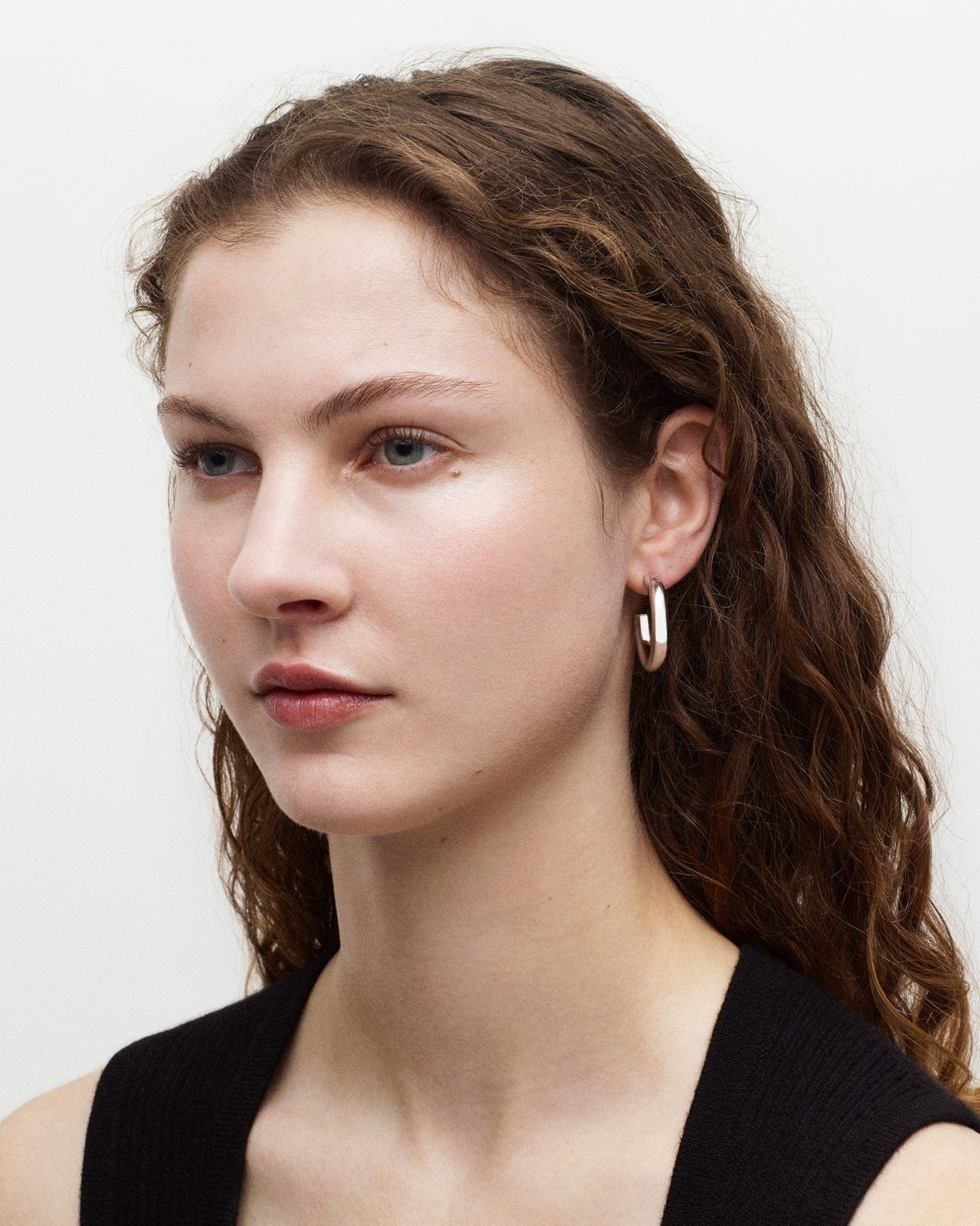 Machete Model Wearing 1" Perfect Hoops in Silver